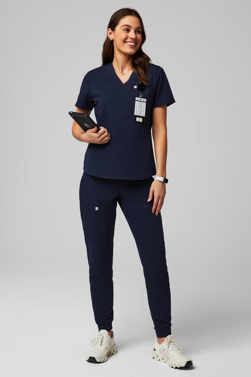 Fabletics Women's Vital 1-Pocket Scrub Top - MotionTech, Wrinkle-Resist, Chest Pocket, Anti-Shrink, Semi-Slim Fit Medium Navy