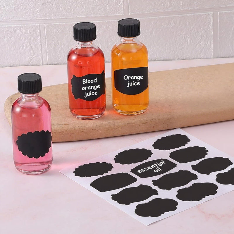 72 Pack 2oz Small Clear Glass Bottles with Lids, Boston Round Bottles | 60ml travel bottles for vanilla, hot sauce, juice, whiskey and liquids, with 72 labels, 5 funnels, 5 droppers and brush