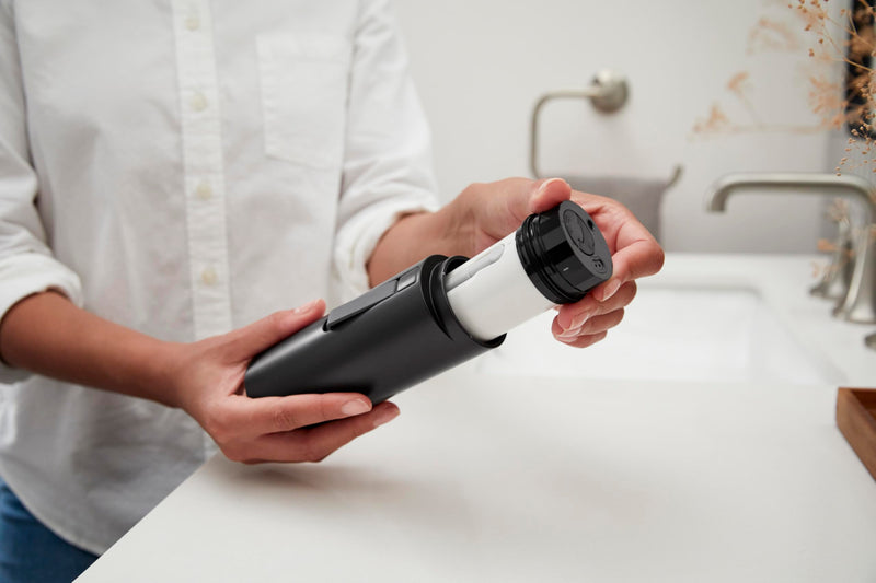 Kohler PureWash M050 Portable Bidet Sprayer, Honed Black, Travel Bidet, Compact Design for Easy Transport with Carrying Strap, Multi-setting Spray Functions, Holds Water for Up to One Minute