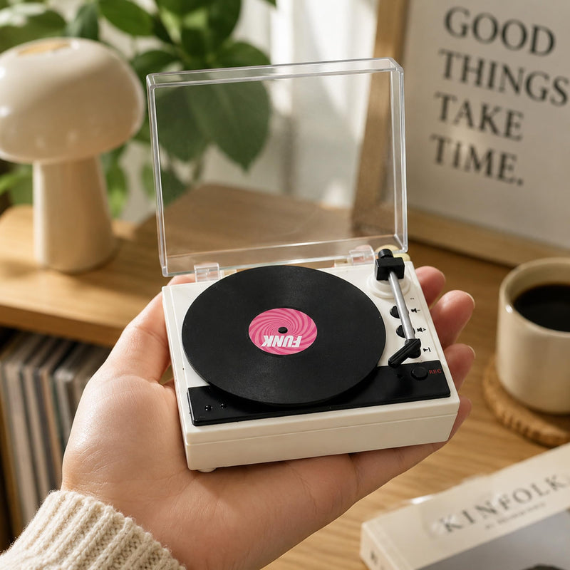 Mini Record Player with Voice Recording, 4 Discs, Auto-Spinning Desk Decor | Includes 3 music discs and 1 blank disc. All 4 discs record. Recording over music erases it permanently. Black