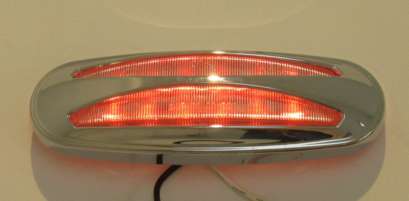  [AUSTRALIA] - Kaper II Auxiliary Light 12 diode; red; clear lens; rated: p2;  connection: 1 eyelet, 1 terminal, with Snap-On chrome bezel;  tested voltage: 12.8 Volts; Material: Polycarbonate lens abs housing.