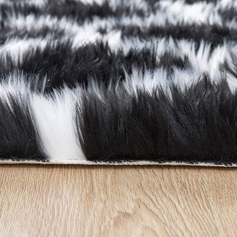  [AUSTRALIA] - Carvapet Moroccan Shaggy Soft Faux Sheepskin Fur Area Rugs Floor Mat Luxury Beside Carpet for Bedroom Living Room 2ft x 4ft, White Strips on Black Black & White